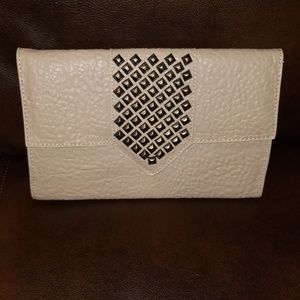 Tan studded clutch